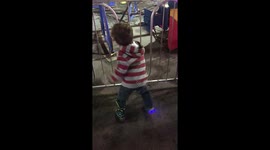 Five year old dances to hip hop music and even pauses for a moment waiting for the next beat.