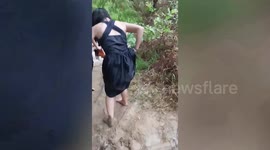 Bridesmaids cross raging river to reach friend’s wedding in the Philippines