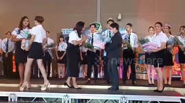 Awkward moment girl falls on stage while accepting graduation award