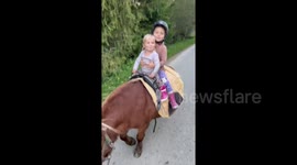 These girls absolutely love taking care of their pony named Boris