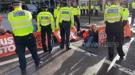 Just Stop Oil activists glue themselves to road near Mansion House, London