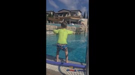 My 5 year old son dancing and jumping in swimming pool