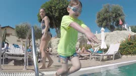 Teaching child to swim on holiday