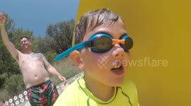 Child enjoying water slide