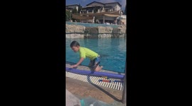 Child dancing by the pool