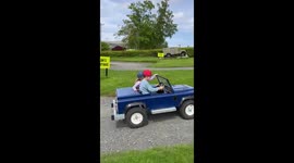 Cute kids driving jeep