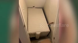 Hilarious moment mother gets stuck in her basement after plugging her stairwell with a sofa