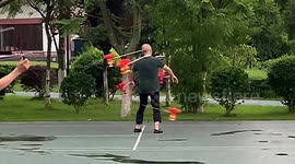 Elderly Chinese man plays with SIX diabolos at the same time
