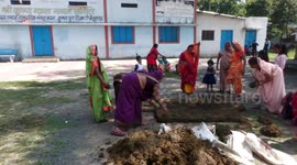 Children plopped in cow dung during bizarre festival in central India