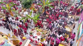 Drone footage shows devotees praying for luck during Thai Buddhist ceremony
