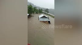 Home swept away in floods as Typhoon Nalgae hits the Philippines, killing 72