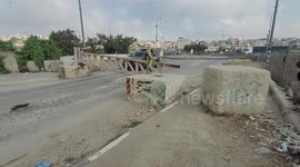 Members of the Israeli forces mans a checkpoint blocking an entrance the West Bank city of Hebron a day after a Palestinian assailant shot dead an Israeli and wounded four others, including another Palestinian, before being killed by a security guard