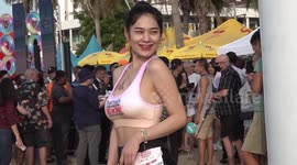 Beachgoers show off their toned bodies at bikini race in Pattaya, Thailand