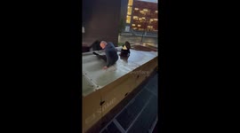 Funny moment British man falls flat on his buttocks as he tries doing parkour