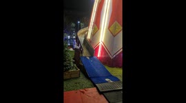 Mum and son on helter-skelter slide at winter wonderland christmas park in Dundee