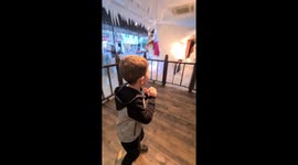 5 year old boy dancing and enjoying  Christmas display at Gillies I'm Broughty Ferry in Dundee
