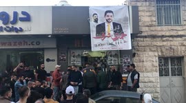 Palestinians reopen Hamdy Sharaf's barber shop, who was shot killed earlier this month during an Israeli militray raid, in the West Bank city of Nablus