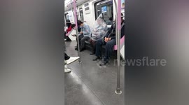 Woman covers herself in plastic bag so she could eat banana on train in China