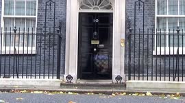 UK Defence Secretary Ben Wallace comes out of 10 Downing Street with poppies