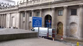 Outside the Bank of England as orange paint is removed after Just Stop Oil fossil fuel protest