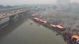 Thousands of devotees take dip into polluted Yamuna river for Hindu festival