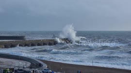 Brighton beach subject to rough waves brought by Storm Claudio