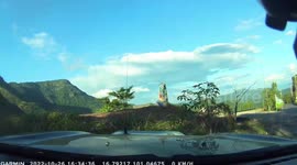 Out-of-control car flies over road while driving down hill in Thailand