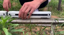 Chinese young man builds 70-metre-long miniature train set in field