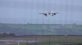 Passenger plane wobbles as it battles Storm Claudio winds during sideways landing