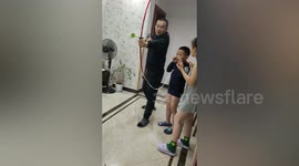 Father pulls out son’s tooth by firing bow and arrow in China
