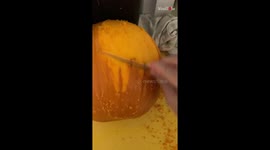 Expert sculptor BONES UP his Halloween game by carving a SKULL out of pumpkin