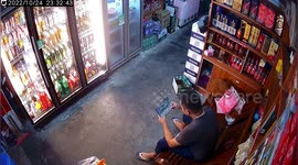 Rat and man both jump after rodent scurries across shop floor in China