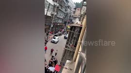 Kind-hearted Chinese residents use quilt to catch toddler falling from building