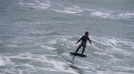 Surfer makes most of rough waves generated by Storm Claudio in Cornwall