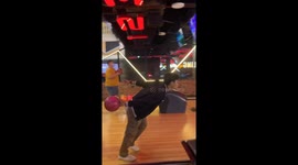 Friends prank their mate by making his fingers stick to bowling ball
