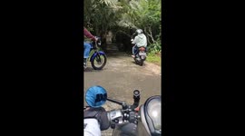 The motorcycle suddenly slipped on the road and the driver and passenger fell