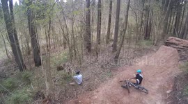 Mountain bikers collide together in has hard crazh while jumping big dirt
