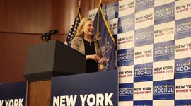 Hillary Clinton hugs Kathy Hochul on stage at campaign rally in New York City before Hochul addresses supporters