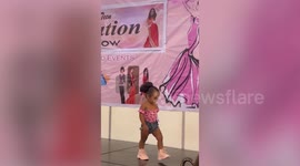 Sassy baby girl owns stage with adorable modelling skills