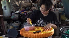 Buddhist devotees make colourful floats from corn for yearly Loy Krathong festival