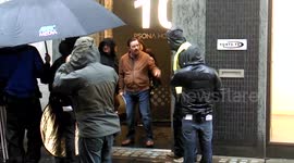 Ricky Gervais braves torrential rain to film new movie