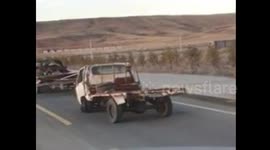 Driver haphazardly bounces along road with flat tyre in China's Shanxi