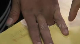 Student manages to get finger completely stuck in school desk