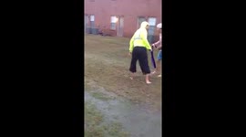US students surf on skateboard during flash flood