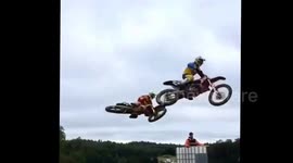Motorcyclist lands on another motorcyclist after big jump