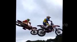 Motorcyclist lands on another motorcyclist after big jump