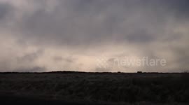 Dramatic winter clouds, snow and strong winds in Northern Ireland