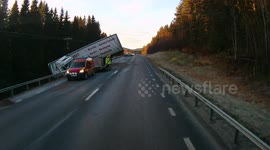 Lorry hangs off edge of bridge after crash