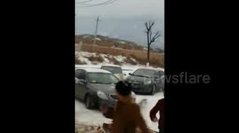 Calamitous multi-car crash on icy road in China