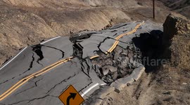 Landslide buckles road in California V19292
